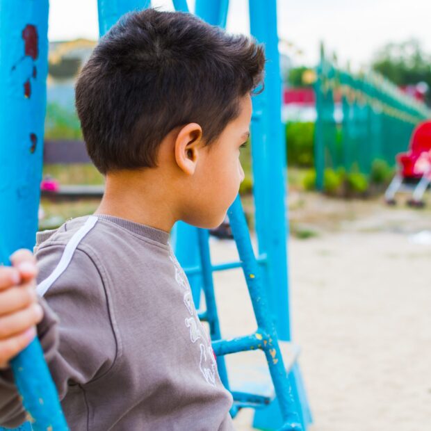 boy swinging on a swing
