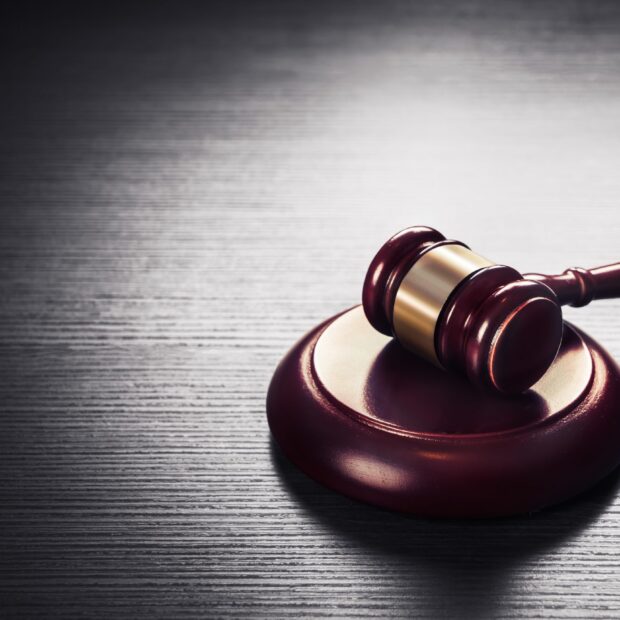 judge gavel on a black wooden background