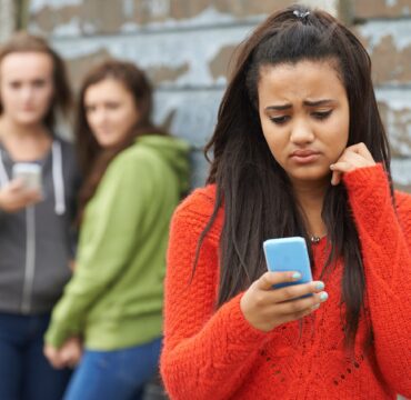 Teenage Girl Being Bullied By Text Message