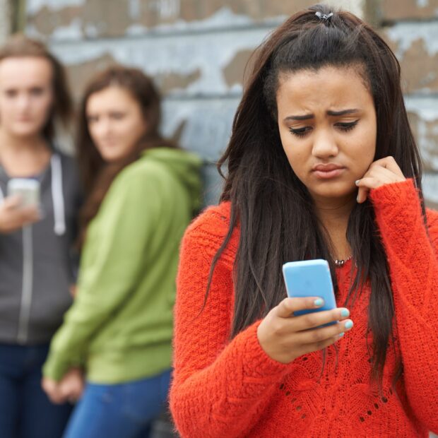 Teenage Girl Being Bullied By Text Message